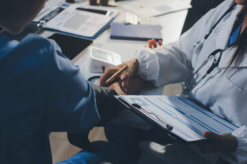 Doctor checking patient arterial blood pressure in hospital. Health care Concept