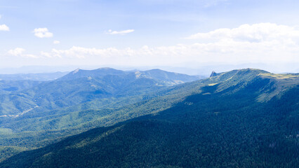 Drone view of vast forested valley and remote villages near Jahorina mountain in Bosnia and...