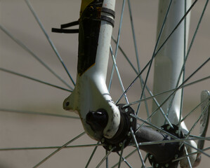 This image provides a detailed closeup view of a bicycle wheel, showcasing the intricacies of the...