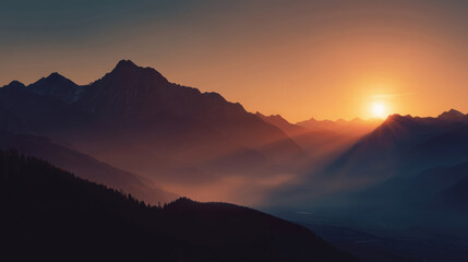 Warm orange sunset glow over mountain silhouettes