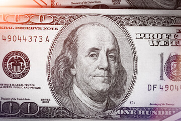 Background from dollar bills. Money background. Pile of money on the table. One hundred dollars..