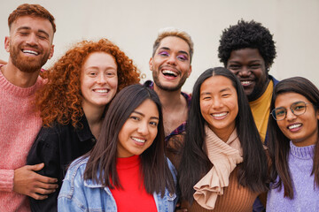 Group of happy multiracial friends smiling on camera outdoor - Diversity, social inclusion and community concept