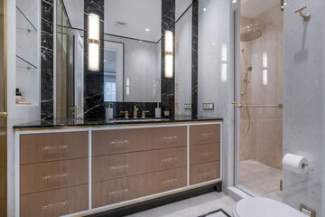 A bathroom with a modern design, elegant finishes and stylish accessories. Soft tones create an...