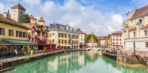 Panorama of the Thiou river flowing through historic Annecy, France