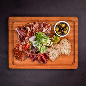 Assorted Charcuterie Platter with Bread and Olives