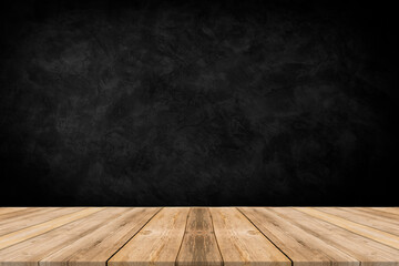 Rough wooden table with black wall background