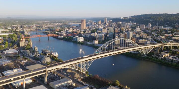 Portland Oregon - Aerial Approach over Bridges and River at Sunset Towards Downtown Portland Skyline and City