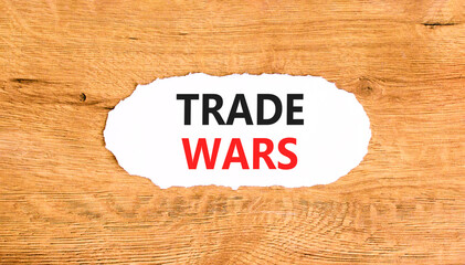 Trade wars symbol. Concept word Trade wars on beautiful white paper. Beautiful wooden paper...