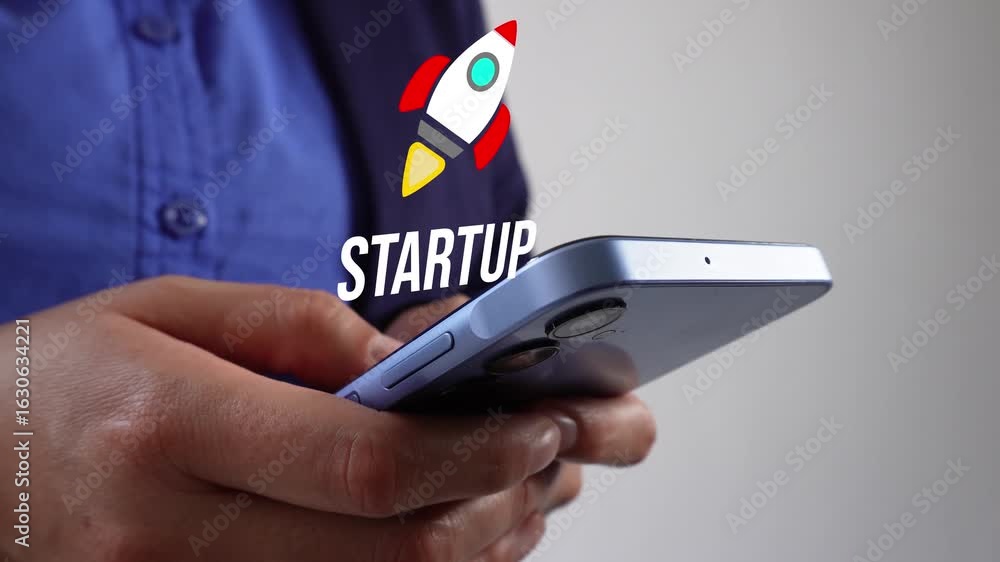 Poster person holding a cell phone with a floating animation of a rocket and the word startup