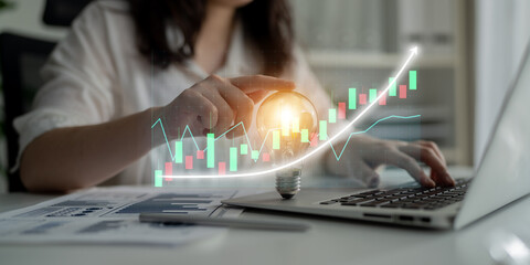 Professional analyzing financial statistics on a laptop while incorporating innovative ideas and strategies for success using creative visual elements and data analysis. Impute