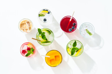 Summer drinks, colored cocktails on white background.