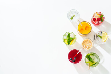 Summer drinks, colored cocktails on white background.