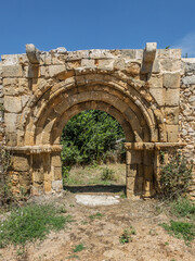 Cyclist paused at San Juan Bautista ruins in Calatanazor, Spain