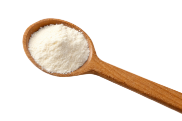 Wooden spoon with fine white powder for baking and cooking in kitchen on black background photo