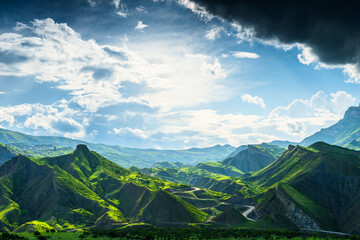 Picturesque mountain landscape with green mountains and dramatic sky. Dagestan, Caucasus