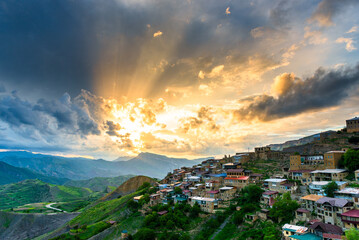 Picturesque sunset sky over the mountain village of Chokh. Caucasus