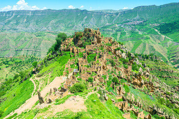 View of the ruins of an abandoned mountain village in the mountains of the North Caucasus