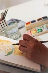child draws paints