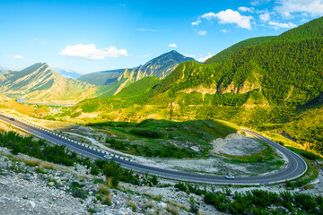 Beautiful view of picturesque mountains with a bend in the road on the rise in the mountains of the...