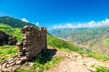 Picturesque view with ruins above a mountain canyon. North Caucasus
