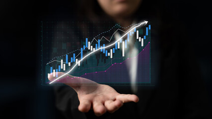 Business professional displays a digital financial chart in a dark setting, symbolizing growth, investment strategy, and data analysis for corporate success. Impute