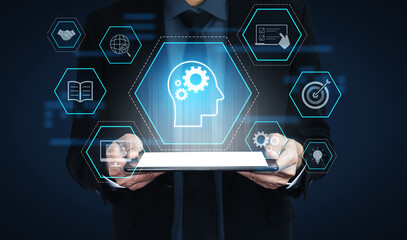 Head with gear and icons representing learning, digital training, and development process, showing...