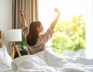 Woman Stretching in Bed with Morning Light