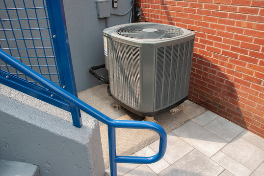 Heat pump unit at bottom of staircase