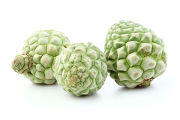 Fototapeta premium Three green sugar apples with unique bumpy skin on a clean white background.