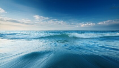 serene ocean waves under soft sky during calm daylight