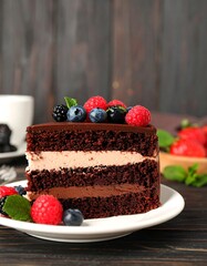 Chocolate cake slice with berries (1)