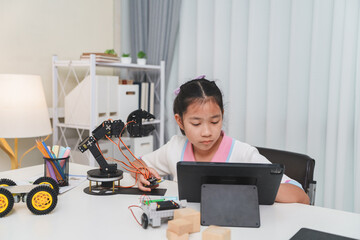 A young student engaged in an e-learning class for her engineering project.