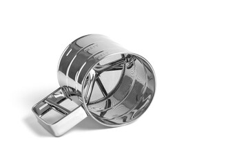 Stainless steel measuring cup with sifter on white background.
