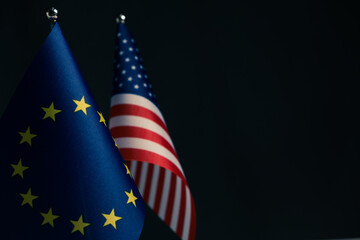European Union and United States of America flags isolated on black background.