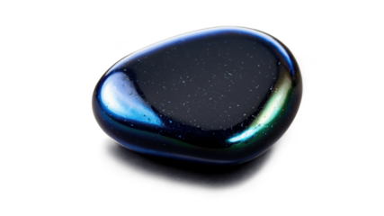 Shiny black and blue polished stone resting on a white surface in natural light, showcasing smooth texture and vibrant color variations