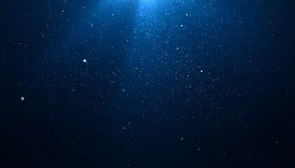 Floating dust particles illuminated by a single cinematic beam of light on a dark gradient background