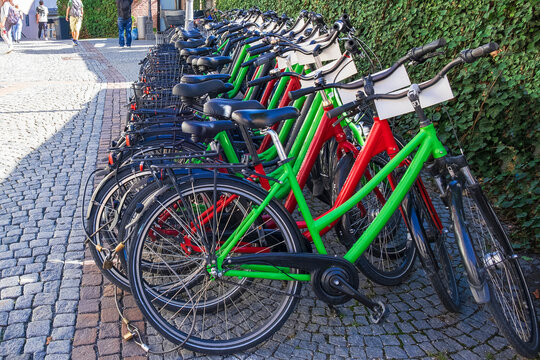Row of colorful bicycles parked in Munich city center.