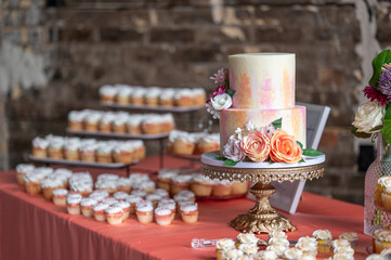 Elegant Wedding Reception with Dessert Table and Floral Decorations