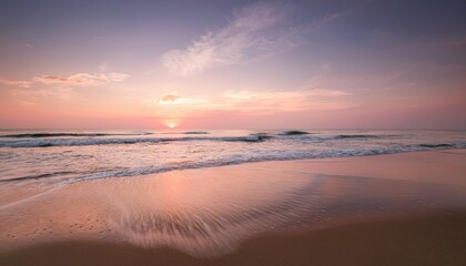 soft pink sunset over calm ocean beach