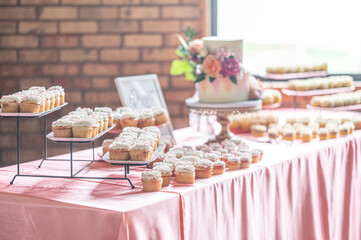 Elegant Wedding Reception with Dessert Table and Floral Decorations