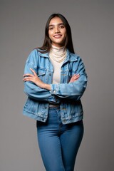 Confident Young Woman in Denim Jacket and Pearls