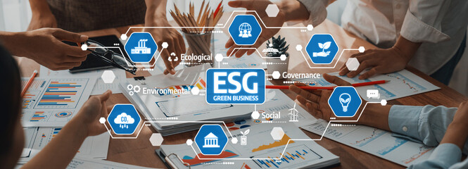 A dynamic corporate meeting illustrating teamwork and strategic planning for ESG green business initiatives with charts and collaborative discussions. Amity