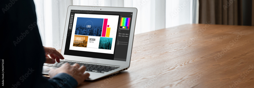 Poster graphic designer software for modern design of web page and commercial ads showing on the computer s