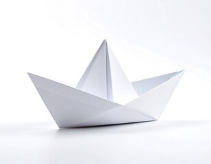 Folded paper ship against a bright background