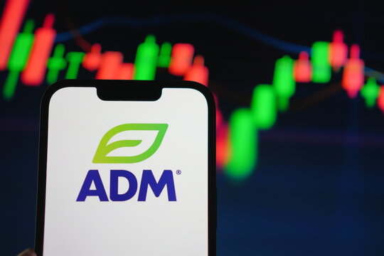 Roosendaal, The Netherlands - August 05, 2025: A mobile phone displaying the company logo of Adm, with a stock chart in the background.