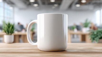 Fototapeta premium A white ceramic mug stands on a wooden table with an office background, ready for a morning coffee.