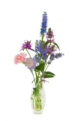 Simple posy of wild flowers in a small glass vase isolated on a white background
