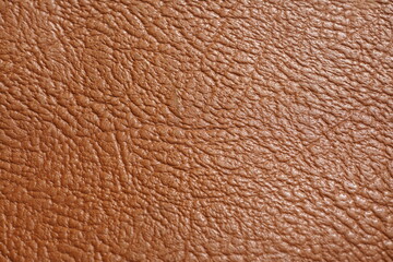 Textur eines groben Leders mit Narben der Hautoberfläche in rotbraun