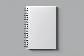 Blank spiral-bound notebook on a gray background