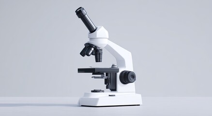 White microscope on a light gray surface